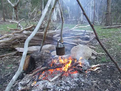 Camping bushcraft tripod use.